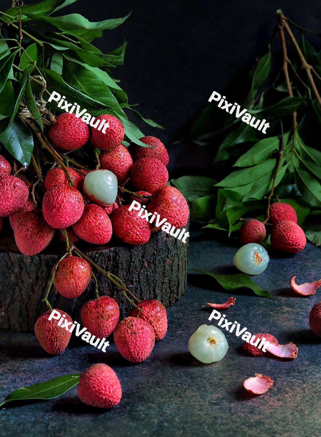 Lychee fruit on a tree log